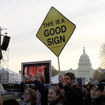 Eric Dennis holds a giant yellow This Is A Good Sign near the U.S. Capitol during the 2010 rally